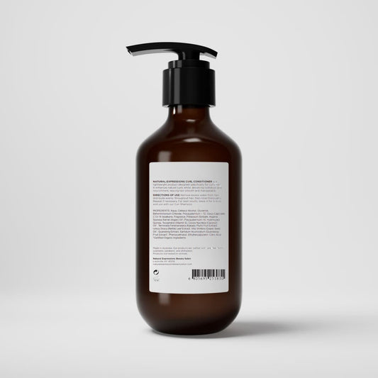 Brown bottle with pump and white label on a light gray background